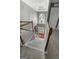 Spacious foyer with high ceilings, a grand staircase, and a view of the front door and transom window at 440 Homeplace Dr, Stockbridge, GA 30281