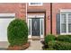 Close-up of the front door, showcasing leaded glass and decorative sidelights at 440 Homeplace Dr, Stockbridge, GA 30281