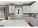 Bright kitchen featuring white cabinetry, light countertops, and stainless steel appliances at 440 Homeplace Dr, Stockbridge, GA 30281