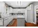 Bright kitchen with white cabinets, stainless steel appliances, and a central island with bar seating at 440 Homeplace Dr, Stockbridge, GA 30281