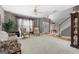 Open living room with neutral carpet, staircase, and traditional furnishings at 440 Homeplace Dr, Stockbridge, GA 30281