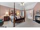 This primary suite features an ensuite bathroom, fireplace, and neutral colored carpet at 440 Homeplace Dr, Stockbridge, GA 30281
