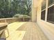 Back deck of home with wood flooring and railing overlooking the backyard at 60 Carriage Gate Dr, Sharpsburg, GA 30277