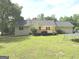 Spacious backyard with lush lawn, deck and mature trees at 60 Carriage Gate Dr, Sharpsburg, GA 30277