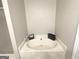 Bathroom view showcasing a soaking tub with tile surround at 60 Carriage Gate Dr, Sharpsburg, GA 30277