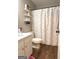 Bathroom features vinyl flooring, bright lighting, and cheerful polka-dot shower curtain at 60 Carriage Gate Dr, Sharpsburg, GA 30277