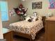 Comfortable bedroom with floral bedding and natural light at 60 Carriage Gate Dr, Sharpsburg, GA 30277