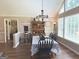Dining room featuring hardwood floors and ample lighting at 60 Carriage Gate Dr, Sharpsburg, GA 30277