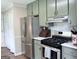 Kitchen featuring stainless steel appliances and mosaic backsplash at 60 Carriage Gate Dr, Sharpsburg, GA 30277