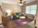 Cozy playroom with hardwood flooring, ceiling fan, and window light at 60 Carriage Gate Dr, Sharpsburg, GA 30277
