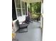 Cozy porch area with chairs and decor at 60 Carriage Gate Dr, Sharpsburg, GA 30277