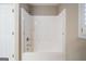 Bathroom with a white bathtub and shower combination at 7963 Smith Rd, Villa Rica, GA 30180