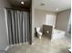 Spacious bathroom featuring a separate shower and a luxurious soaking tub next to the toilet at 7963 Smith Rd, Villa Rica, GA 30180