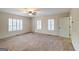 Bedroom featuring carpet, a ceiling fan, and shuttered windows at 7963 Smith Rd, Villa Rica, GA 30180