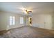 Spacious bedroom with carpet flooring, ceiling fan, and lots of natural light at 7963 Smith Rd, Villa Rica, GA 30180