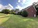 Beautiful one-story house featuring manicured lawn and decorative shrubs at 7963 Smith Rd, Villa Rica, GA 30180