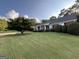 A beautiful one-story house with a large front yard, landscaping, and manicured lawn at 7963 Smith Rd, Villa Rica, GA 30180