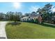 A beautiful home surrounded by large trees on a sunny day at 7963 Smith Rd, Villa Rica, GA 30180
