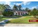 Charming brick home on 4.5 acres with manicured lawn and inviting curb appeal at 7963 Smith Rd, Villa Rica, GA 30180