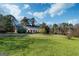 Attractive brick home with a long driveway, set on a sprawling, grassy lot at 7963 Smith Rd, Villa Rica, GA 30180
