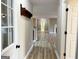Hallway with hardwood floors connecting to various rooms of the home at 7963 Smith Rd, Villa Rica, GA 30180