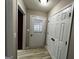 Hallway with a door to the exterior and interior access doors at 7963 Smith Rd, Villa Rica, GA 30180