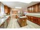 Well-appointed kitchen with island cooktop, granite countertops, and stainless steel appliances at 7963 Smith Rd, Villa Rica, GA 30180