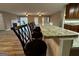 Kitchen bar with granite countertop and seating that overlooks the living room at 7963 Smith Rd, Villa Rica, GA 30180