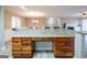 Kitchen bar overlooking eat-in kitchen with stainless steel appliances and hardwood floors at 7963 Smith Rd, Villa Rica, GA 30180