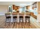 Kitchen features a large granite island with seating and custom cabinetry at 7963 Smith Rd, Villa Rica, GA 30180