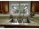 Features a stainless steel kitchen sink with view from window at 7963 Smith Rd, Villa Rica, GA 30180