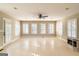 Large living room with multiple windows and a ceiling fan at 7963 Smith Rd, Villa Rica, GA 30180