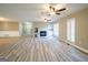 Open living room layout, highlighting the seamless flow to the dining area and fireplace feature at 7963 Smith Rd, Villa Rica, GA 30180