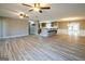 Bright, open-concept living space with modern flooring and seamless flow to the kitchen at 7963 Smith Rd, Villa Rica, GA 30180