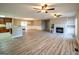 Spacious living room featuring new flooring, a cozy fireplace, and abundant natural light at 7963 Smith Rd, Villa Rica, GA 30180