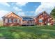 Rear view of a brick home with a cozy deck and a well-maintained yard at 7963 Smith Rd, Villa Rica, GA 30180