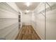 Large walk-in closet with ample shelving and carpet flooring at 7963 Smith Rd, Villa Rica, GA 30180