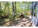 Private backyard area with an outdoor brick oven providing a unique rustic amenity at 1597 Leguin Mill Rd, Locust Grove, GA 30248