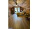 Bedroom with wood-paneled walls and ceilings with access to a balcony with nature views creating a cozy and serene retreat at 1597 Leguin Mill Rd, Locust Grove, GA 30248