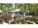 View of home with a large front porch, back deck, and a matching garage at 1597 Leguin Mill Rd, Locust Grove, GA 30248
