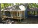 Exterior view of the home with screened in porch, offering an outdoor living space at 1597 Leguin Mill Rd, Locust Grove, GA 30248