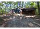 Home featuring the fenced yard, garage, and back door at 1597 Leguin Mill Rd, Locust Grove, GA 30248
