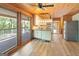 Bright kitchen with access to the deck, featuring granite countertops, stainless steel appliances, and ample natural light at 1597 Leguin Mill Rd, Locust Grove, GA 30248