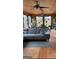 Cozy living room with hardwood floors, large windows, and comfortable seating at 1597 Leguin Mill Rd, Locust Grove, GA 30248