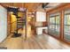 Open living area with spiral staircase, built-in desk and cabinets, and a view of the outdoor scenery at 1597 Leguin Mill Rd, Locust Grove, GA 30248