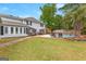 Backyard with a sparkling pool, an inviting patio area, and beautiful landscaping creating a private oasis at 317 Calgary Dr, Peachtree City, GA 30269