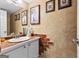 Charming bathroom with unique brick accents, textured walls, and a decorative vanity at 317 Calgary Dr, Peachtree City, GA 30269