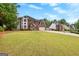 Beautiful two-story brick home with a well-manicured lawn and attached two-car garage at 317 Calgary Dr, Peachtree City, GA 30269