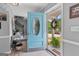 Inviting foyer with light blue door and tile flooring, leading to the staircase and entryway at 317 Calgary Dr, Peachtree City, GA 30269