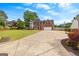 Charming two-story brick home with a well-manicured lawn, a wide driveway, and inviting curb appeal at 317 Calgary Dr, Peachtree City, GA 30269